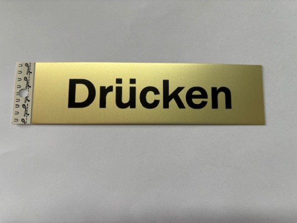 Drücken gold